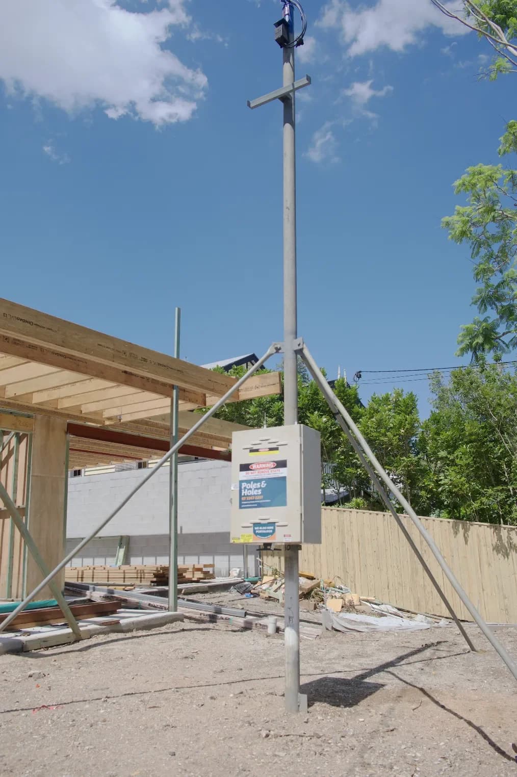 Poles and Holes temporary power pole installed at a construction site
