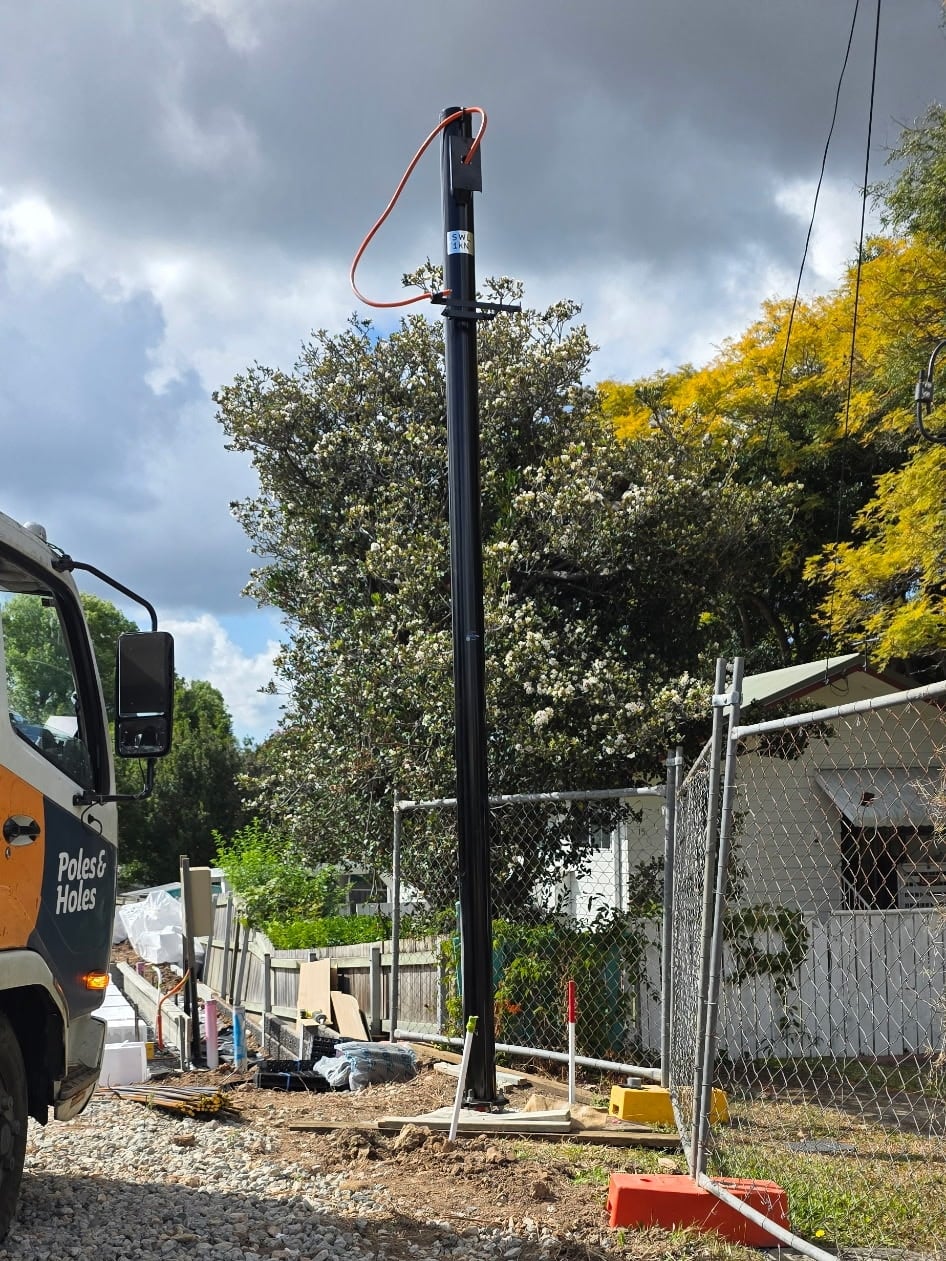 Powder-coated permanent power pole on the Poles and Holes truck